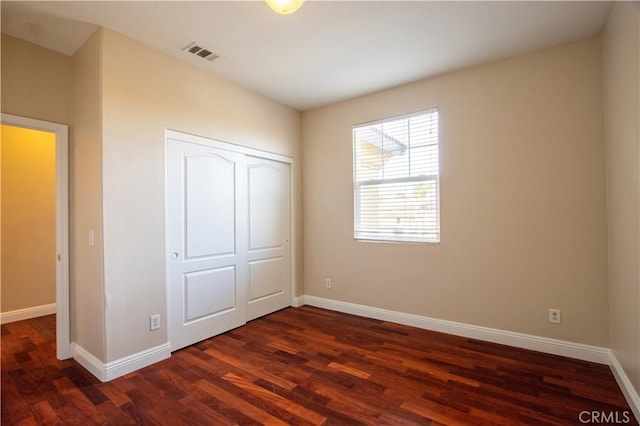 23531 Hobart Ct, Murrieta, CA 92562 - unfurnished bedroom with dark wood-type flooring and a closet