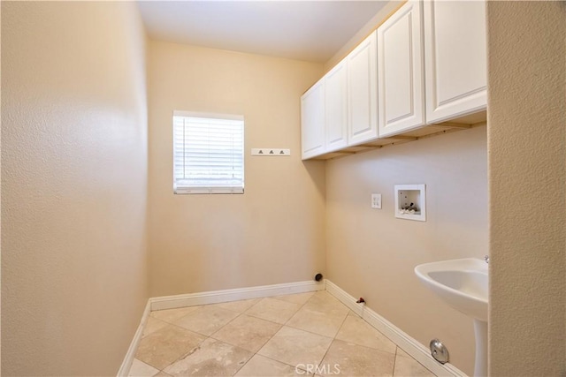 23531 Hobart Ct, Murrieta, CA 92562 - laundry room with washer hookup, cabinet space, light tile patterned flooring, and gas dryer hookup