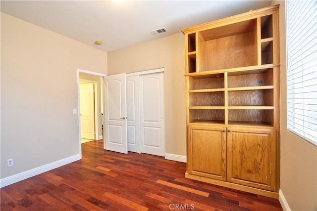 23531 Hobart Ct, Murrieta, CA 92562 - unfurnished bedroom with baseboards, dark wood-style flooring, and a closet