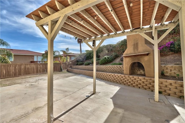 23531 Hobart Ct, Murrieta, CA 92562 - view of patio featuring an outdoor brick fireplace and a fenced backyard