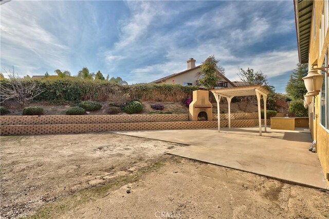 23531 Hobart Ct, Murrieta, CA 92562 - view of yard with a fireplace and a patio area