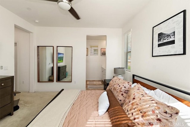 bedroom featuring light carpet and a ceiling fan