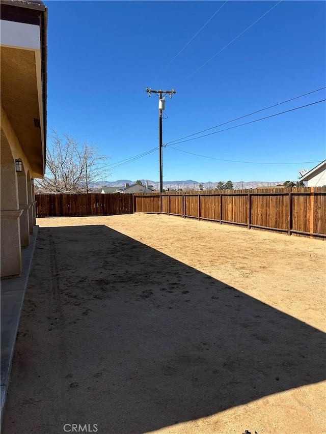 view of yard with a fenced backyard