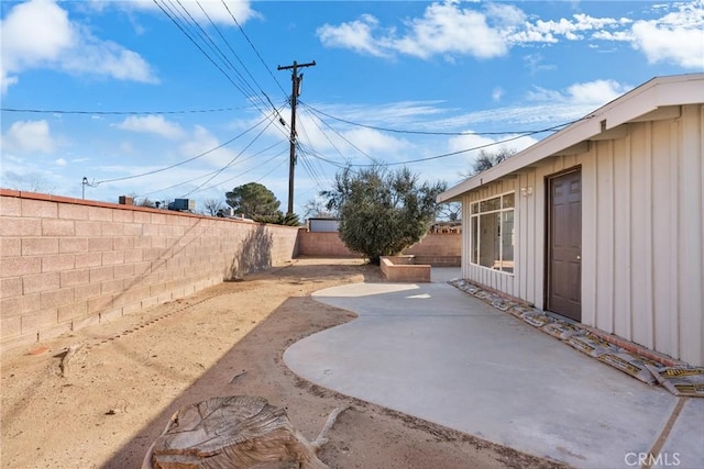 view of yard with a patio and a fenced backyard