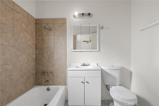 bathroom with shower / bathtub combination, toilet, and vanity