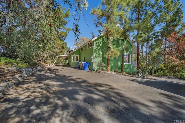 view of home's exterior with driveway