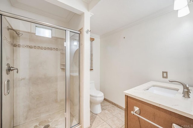 bathroom with vanity, ornamental molding, a stall shower, tile patterned floors, and toilet