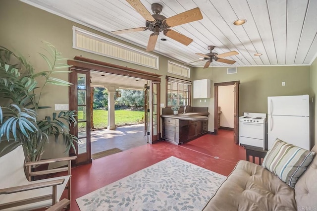 living area with ceiling fan, concrete floors, visible vents, recessed lighting, and wood ceiling