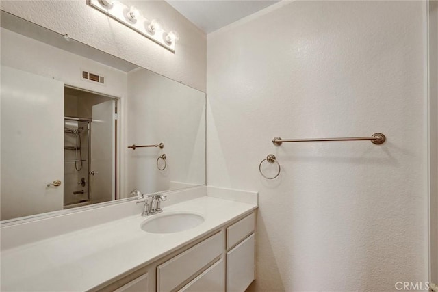 bathroom featuring visible vents and vanity