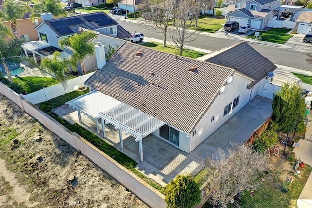 birds eye view of property with a residential view