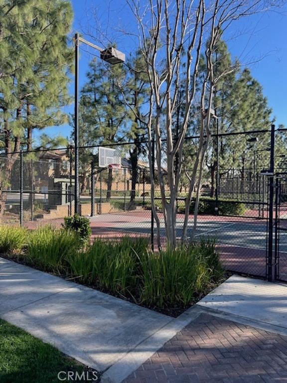 view of sport court with community basketball court and fence