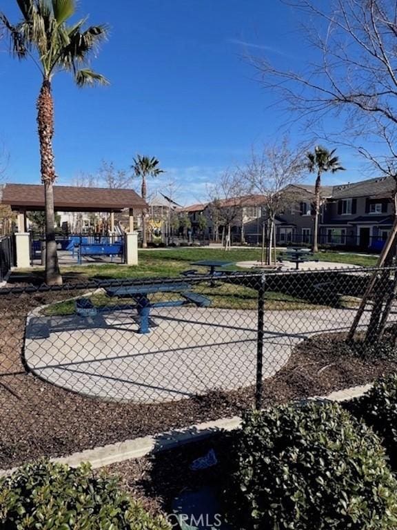 view of community with a residential view and fence