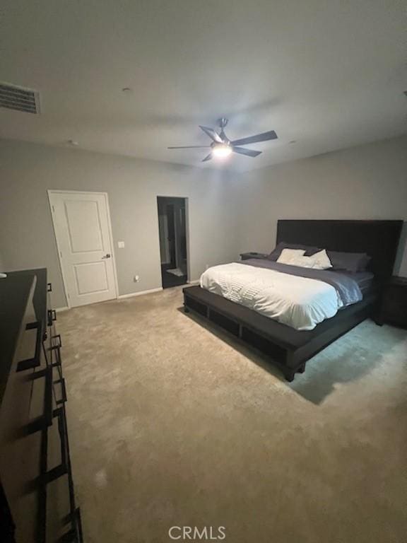 bedroom with carpet, visible vents, ceiling fan, and baseboards