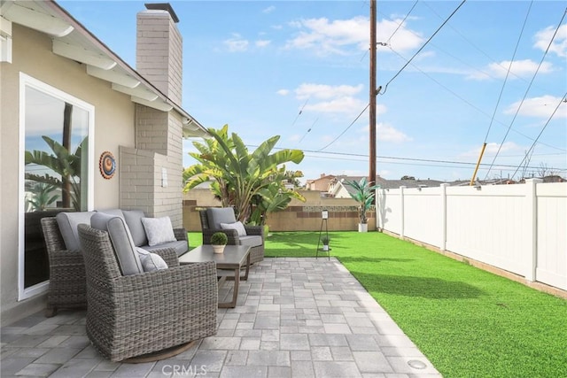 view of patio with a fenced backyard and an outdoor living space