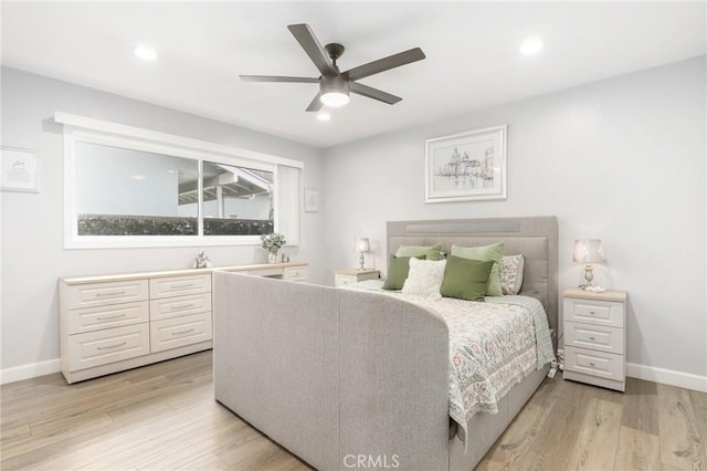 bedroom featuring light wood-style floors, recessed lighting, and baseboards