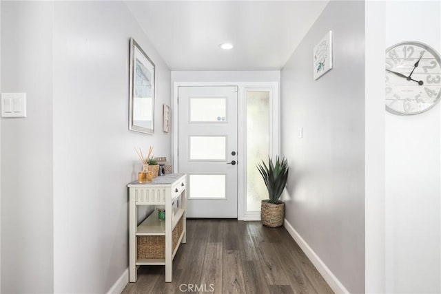 doorway to outside featuring recessed lighting, dark wood finished floors, and baseboards