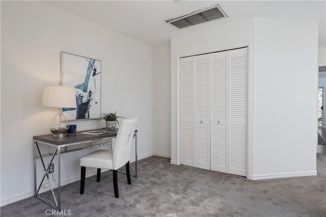 office area with light carpet, baseboards, and visible vents