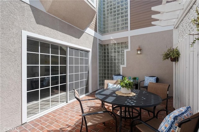 balcony featuring a patio area and outdoor dining space