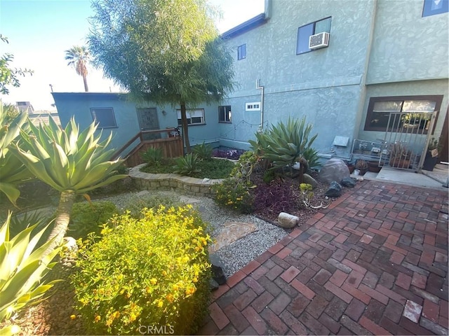 exterior space featuring a patio and stucco siding