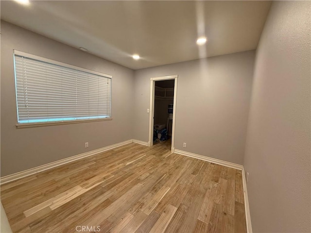 7122 Bluesails Dr, Huntington Beach, CA 92647 - unfurnished room with light wood-type flooring, baseboards, and recessed lighting