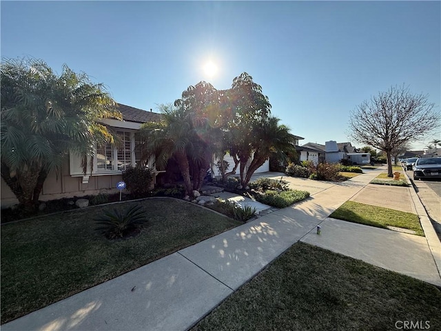 7122 Bluesails Dr, Huntington Beach, CA 92647 - view of front facade featuring a front lawn