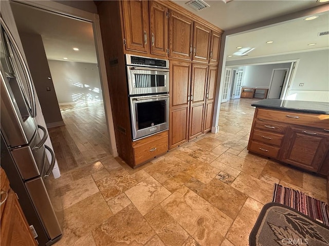 7122 Bluesails Dr, Huntington Beach, CA 92647 - kitchen featuring recessed lighting, stone tile floors, stainless steel appliances, visible vents, and dark countertops