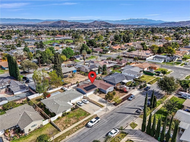 drone / aerial view featuring a residential view and a mountain view