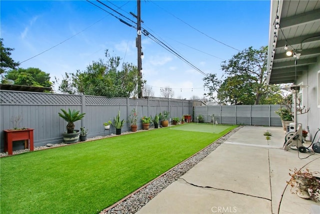 view of yard featuring a patio and a fenced backyard