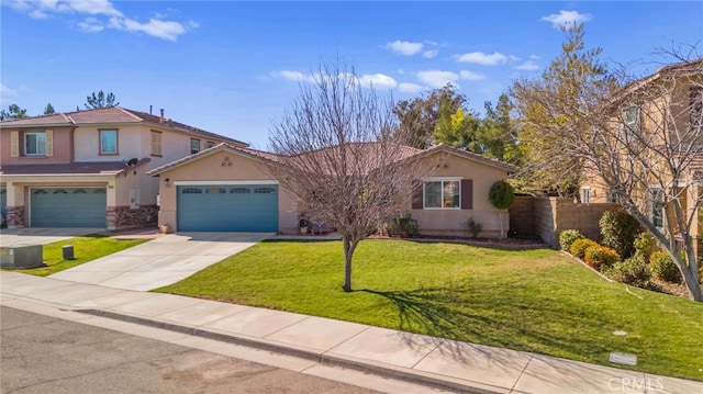 view of front of house with fence, a front lawn, concrete driveway, and stucco siding