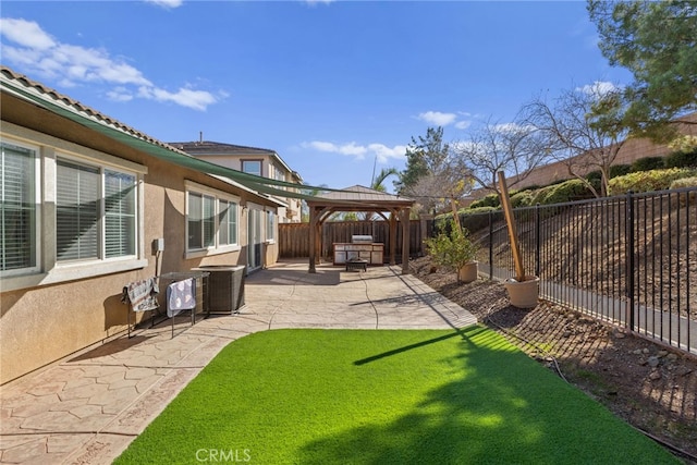 view of yard featuring a fenced backyard, central AC unit, a patio, and a gazebo