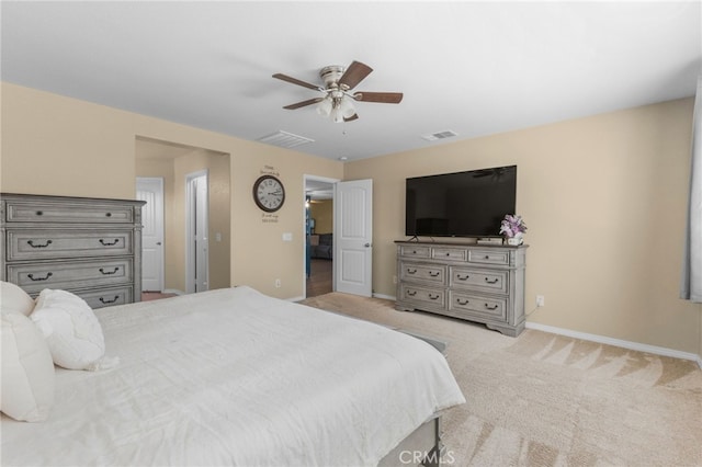 bedroom featuring light carpet, ceiling fan, visible vents, and baseboards