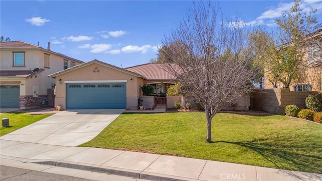 view of front of house featuring driveway, an attached garage, fence, a front lawn, and stucco siding