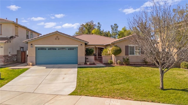 view of front of home with a garage, driveway, stucco siding, a tile roof, and a front yard