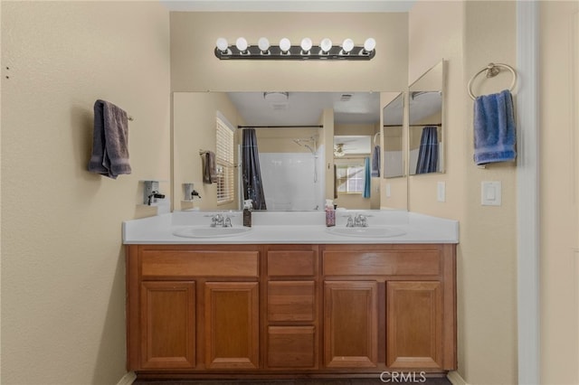 bathroom with double vanity and a sink