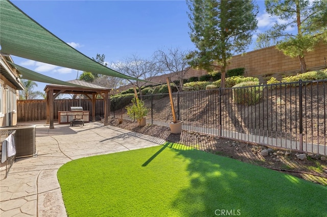 view of yard featuring a gazebo, a patio, a fenced backyard, and central air condition unit