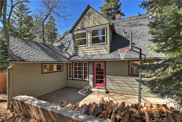 177 Joaquin Miller Rd, Lake Arrowhead, CA 92352 - view of front of home featuring roof with shingles, a patio, an outdoor fire pit, and a chimney