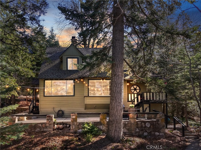 177 Joaquin Miller Rd, Lake Arrowhead, CA 92352 - back of property with stairs and a shingled roof