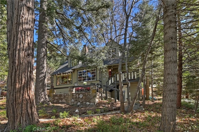 177 Joaquin Miller Rd, Lake Arrowhead, CA 92352 - rear view of house featuring roof with shingles