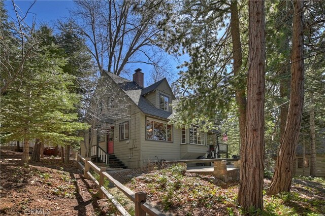 177 Joaquin Miller Rd, Lake Arrowhead, CA 92352 - view of side of property featuring a chimney and roof with shingles