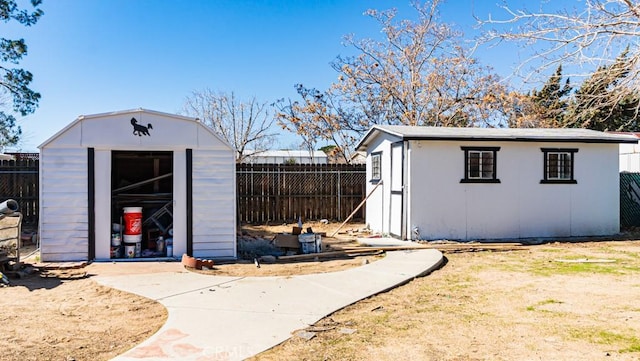 view of shed with fence