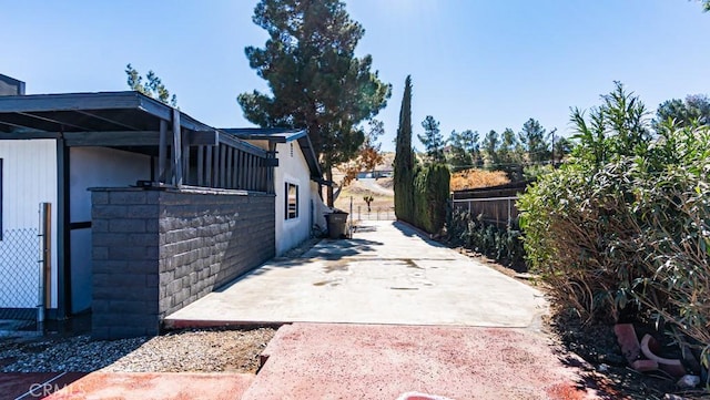 exterior space featuring a patio area and fence