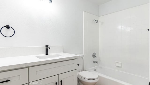 bathroom with toilet, shower / washtub combination, and vanity