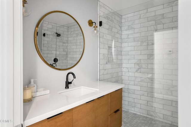 bathroom with a walk in shower and vanity