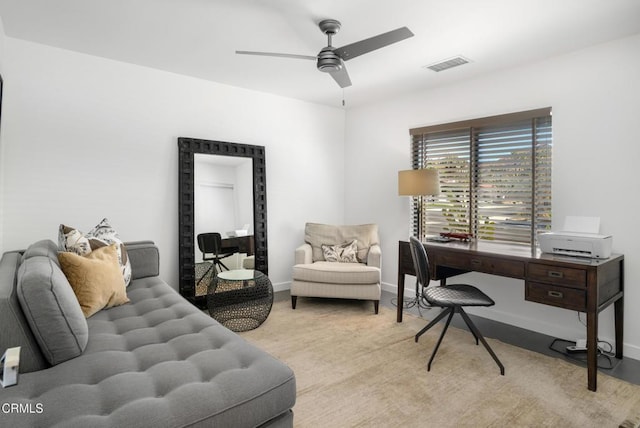 interior space with visible vents, ceiling fan, and baseboards