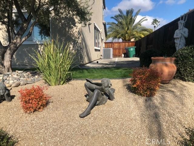 view of yard with a patio and fence