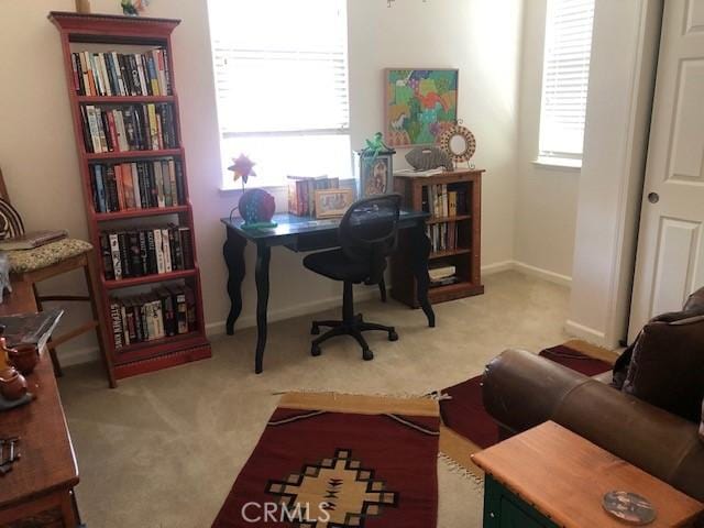 home office featuring carpet and baseboards