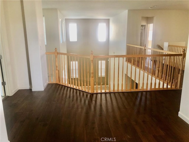 14510 Spyglass Cir, Chowchilla, CA 93610 - hallway featuring wood finished floors, an upstairs landing, and baseboards