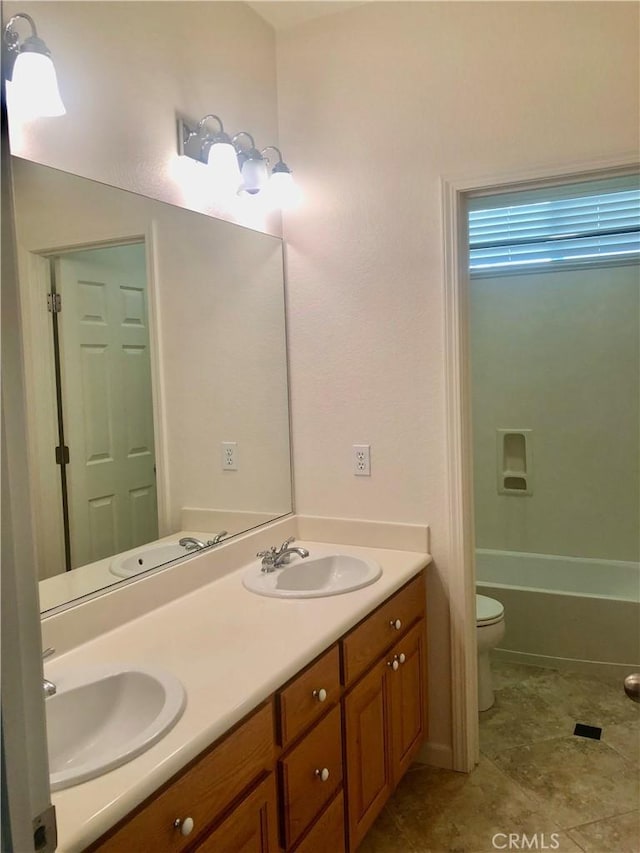 14510 Spyglass Cir, Chowchilla, CA 93610 - bathroom featuring double vanity, toilet, and tile patterned floors