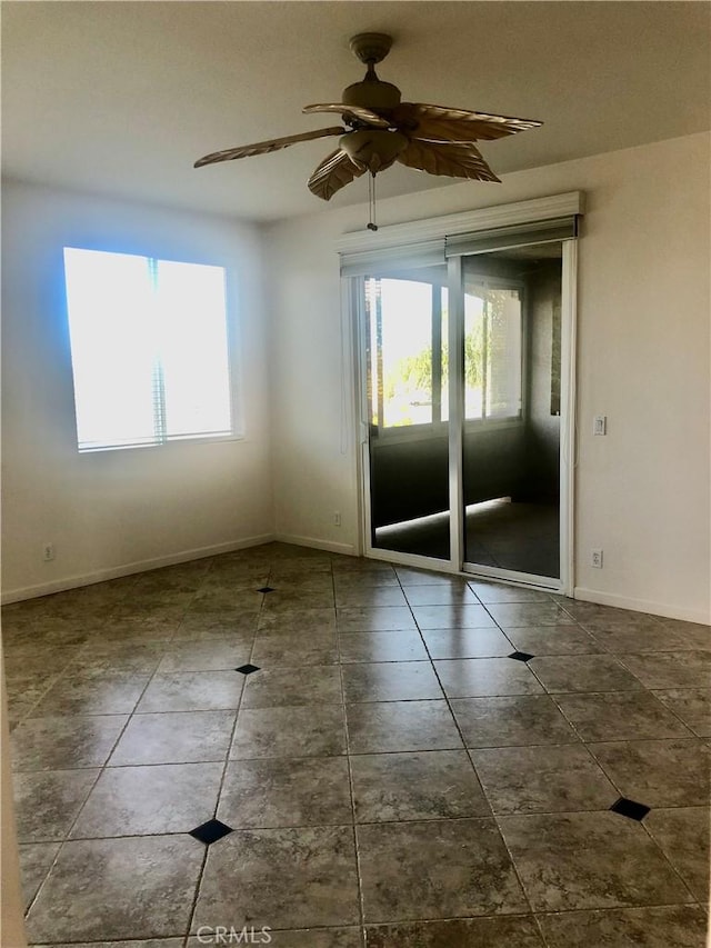 14510 Spyglass Cir, Chowchilla, CA 93610 - tiled empty room with plenty of natural light, baseboards, and ceiling fan
