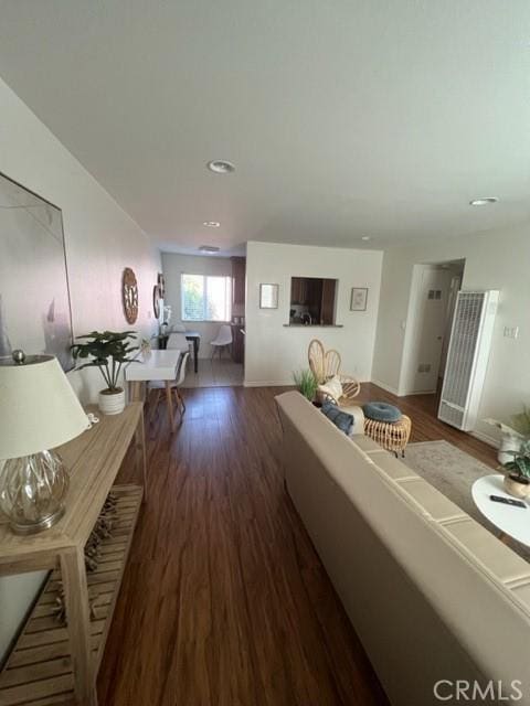 living room featuring dark wood-style flooring